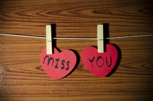 red heart word miss you on wood vintage stlye background