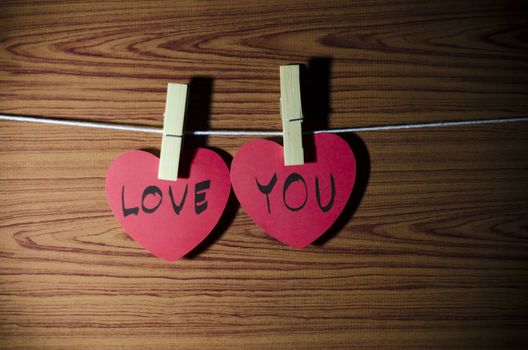 red heart word LOVE YOU on wood vintage stlye background