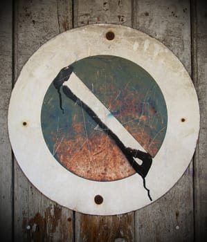 A wooden brown background with a prohibition parking sign
