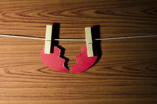 broken red heart word on wood vintage stlye background
