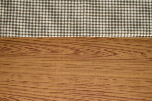 brown kitchen towel pattern on wood background
