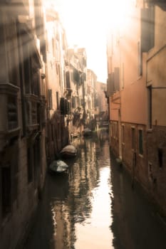 A sunny canal in Venice in the evening