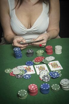 Very beautiful woman playing texas hold'em poker 