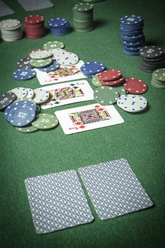 cards poker deck English, poker chips stack on green table 