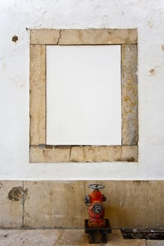 White copyspace in a stone frame with a red hydrant