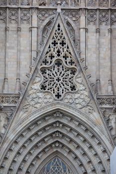 Facade details of famous Gothic Catholic Cathedral, Barcelona, Spain