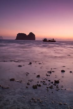 Sunset silhouettes at the beach of the Koh Ngai island Thailand