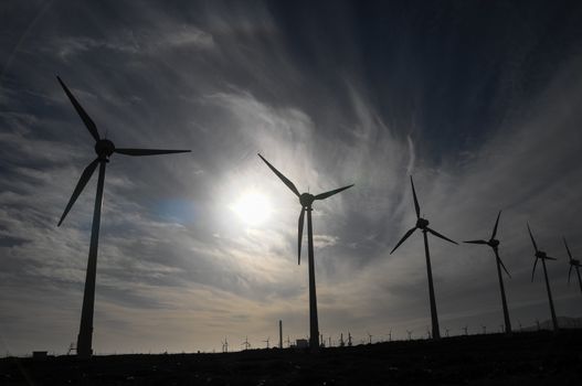 Eletric Power Generator Wind Turbine over a Cloudy Sky