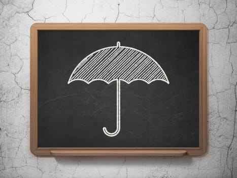 Protection concept: Umbrella icon on Black chalkboard on grunge wall background, 3d render