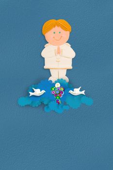 Cute blond boy first communion chalice on blue background with space for writing name and date