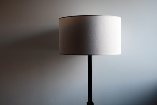 a modern lamp on a white wall