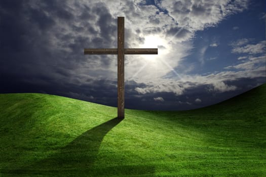 Christian cross of christ in field 
