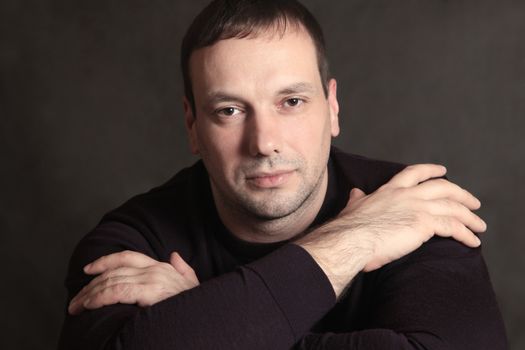 Studio portrait of man isolated on grey background