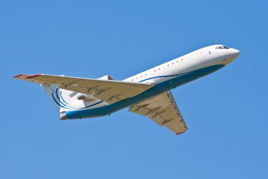 Beautiful white passenger airplane in blue sky