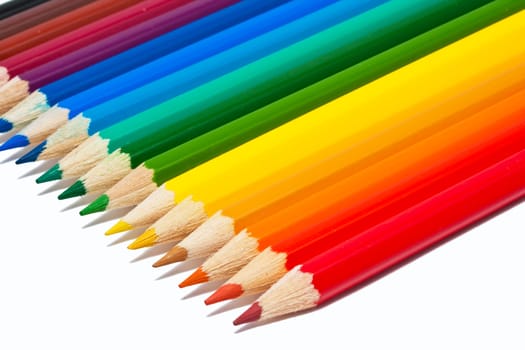 Close up photo of colour pencils isolated on white background