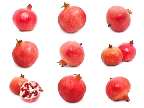 Collection of red pomegranates isolated on white background