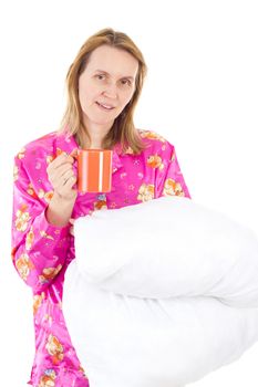 Blond woman starts new day with cup of tea