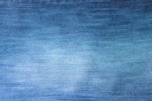 Background made with a close-up picture of blue jeans 