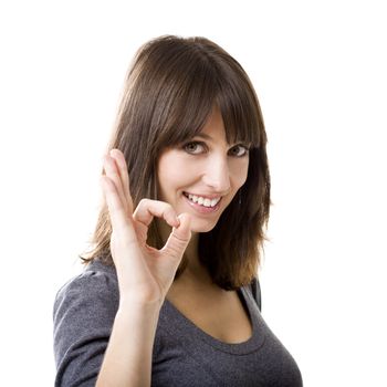 Beautiful woman gesturing an excellent job sign isolated over white background