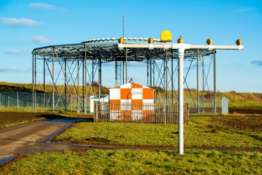 air traffic control, radar with runway lights in front of the airport