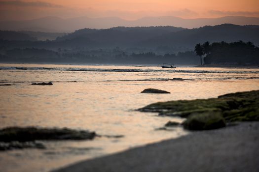 Beautiful landscape picture from a beach in Indonesia at sunset