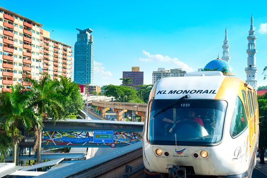 KUALA LUMPUR - MAY 13, 2013: Monorail train arrives at a train station in Kuala Lumpur, Malaysia. Kuala Lumpur metro consists of 6 metro lines operated by 4 operators.