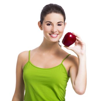 Healthy woman holding a fresh apple, isolated over a white background