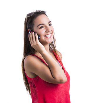 Beautiful woman talking at cell phone, isolated over white background