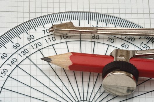 protractor and compass on graph paper