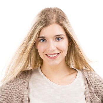 Portrait of a beautiful blonde woman smiling, isolated over white background