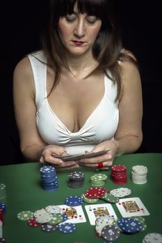 Very beautiful woman playing texas hold'em poker 