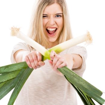 Beautiful blonde woman holding leeks and fighting with them