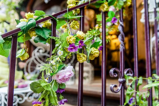 Stair rail with decorative coloful flowers on it