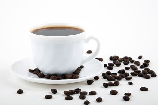 Coffee cup and beans on a white background.