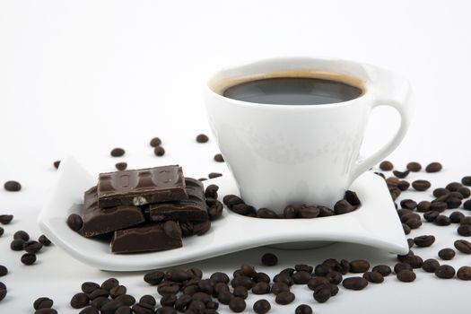 Black coffee with chocolate on a white background.