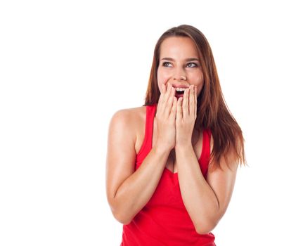 Amazed and cheerful young woman looking something, isolated on white