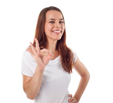 Young casual woman showing ok sign, isolated on white