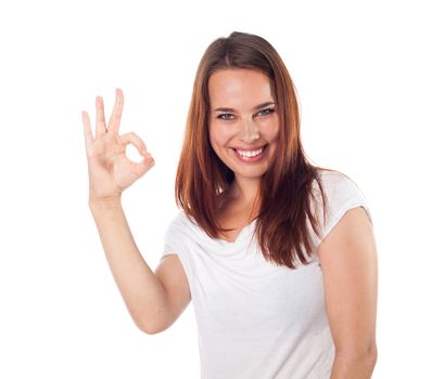 Young cheerful woman showing ok sign, isolated on white
