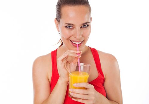 Portrait of a woman drinking an orange juice with a straw, isolated on white