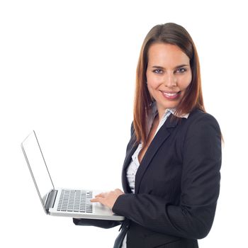 Smiling business woman standing holding her laptop, isolated on white 