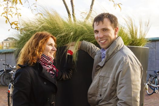 Outdoor happy couple in love, Museum Plein, autumn Amsterdam background