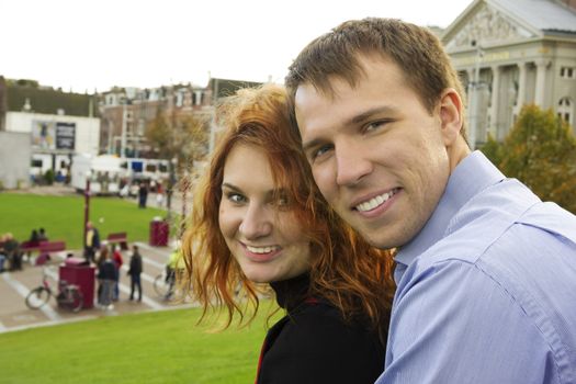 Outdoor happy couple in love, Museum Plein, autumn Amsterdam background