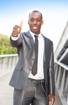 Portrait of a handsome businessman with successful gesturing