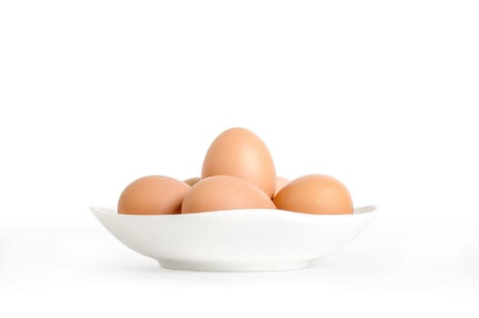 eggs in white dish on white background with clipping path