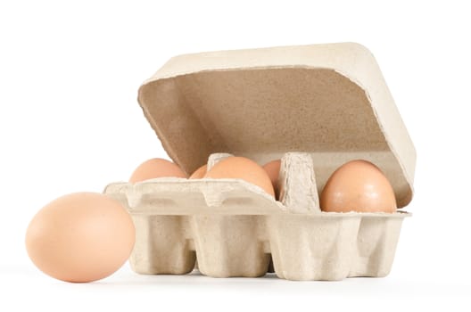 eggs in cardboard tray on white background with clipping path