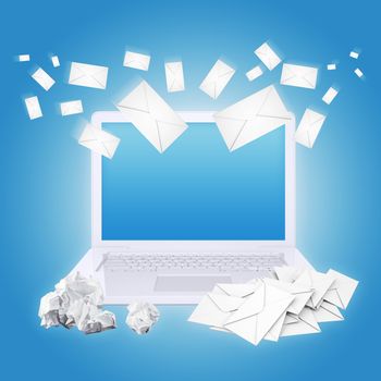 Laptop crumpled paper and envelopes. The concept of e-mailing