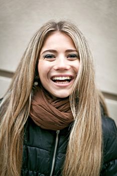 Closeup portrait of a cheerful young woman
