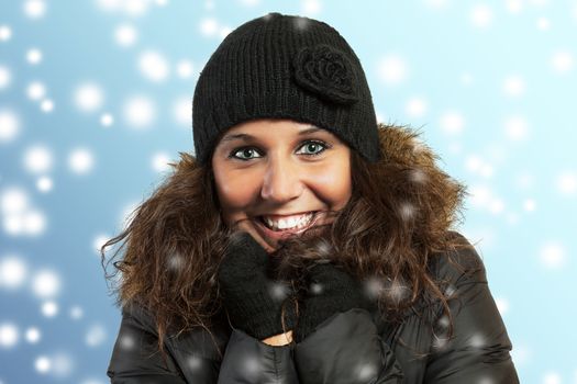Portrait of a nice young woman and winter background, in studio