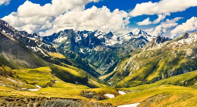 Landscape in French Alps with a view of a valley and mountain ranges