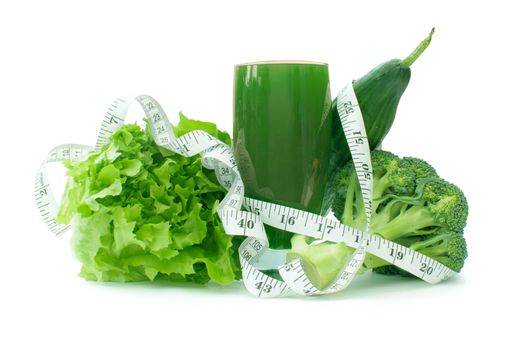 Tape measure wrapped around a smoothie juice drink containing healthy green vegetables